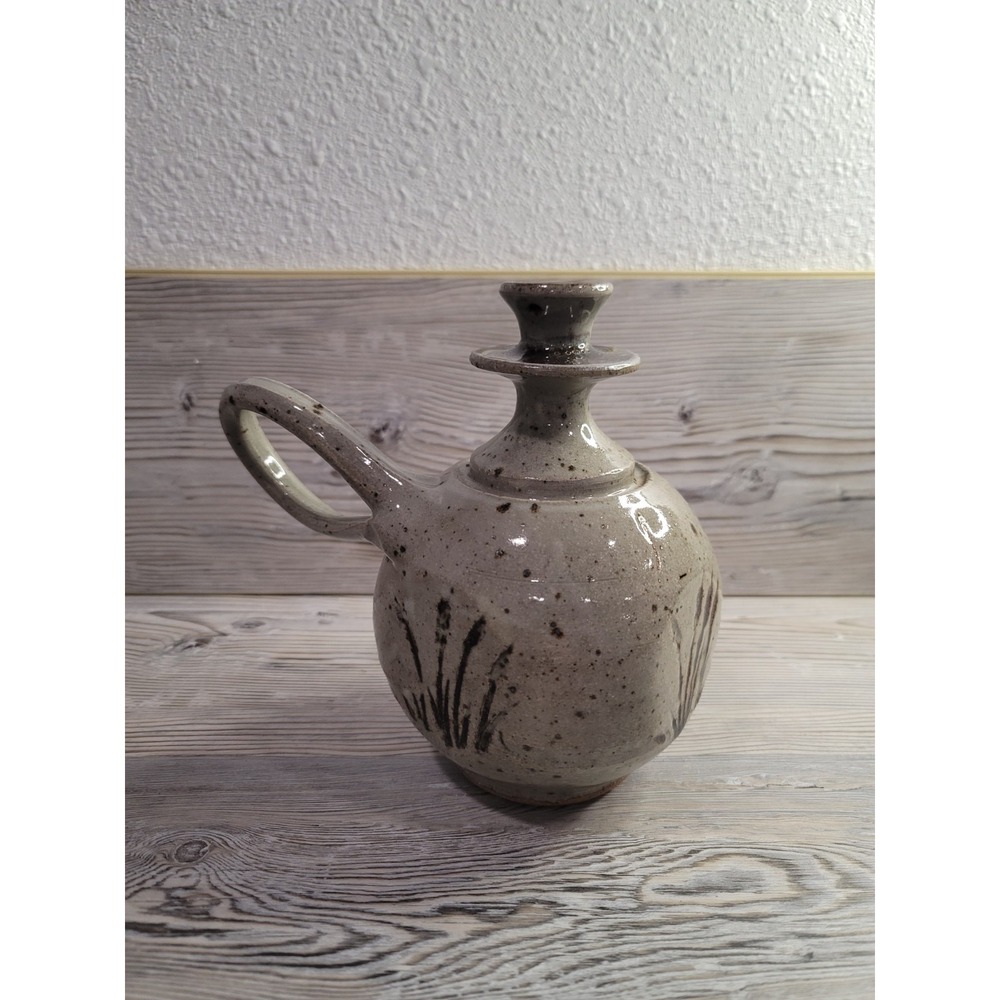 Ceramic Vase with unquie shape and handle. Green gray speckled with cat tails,